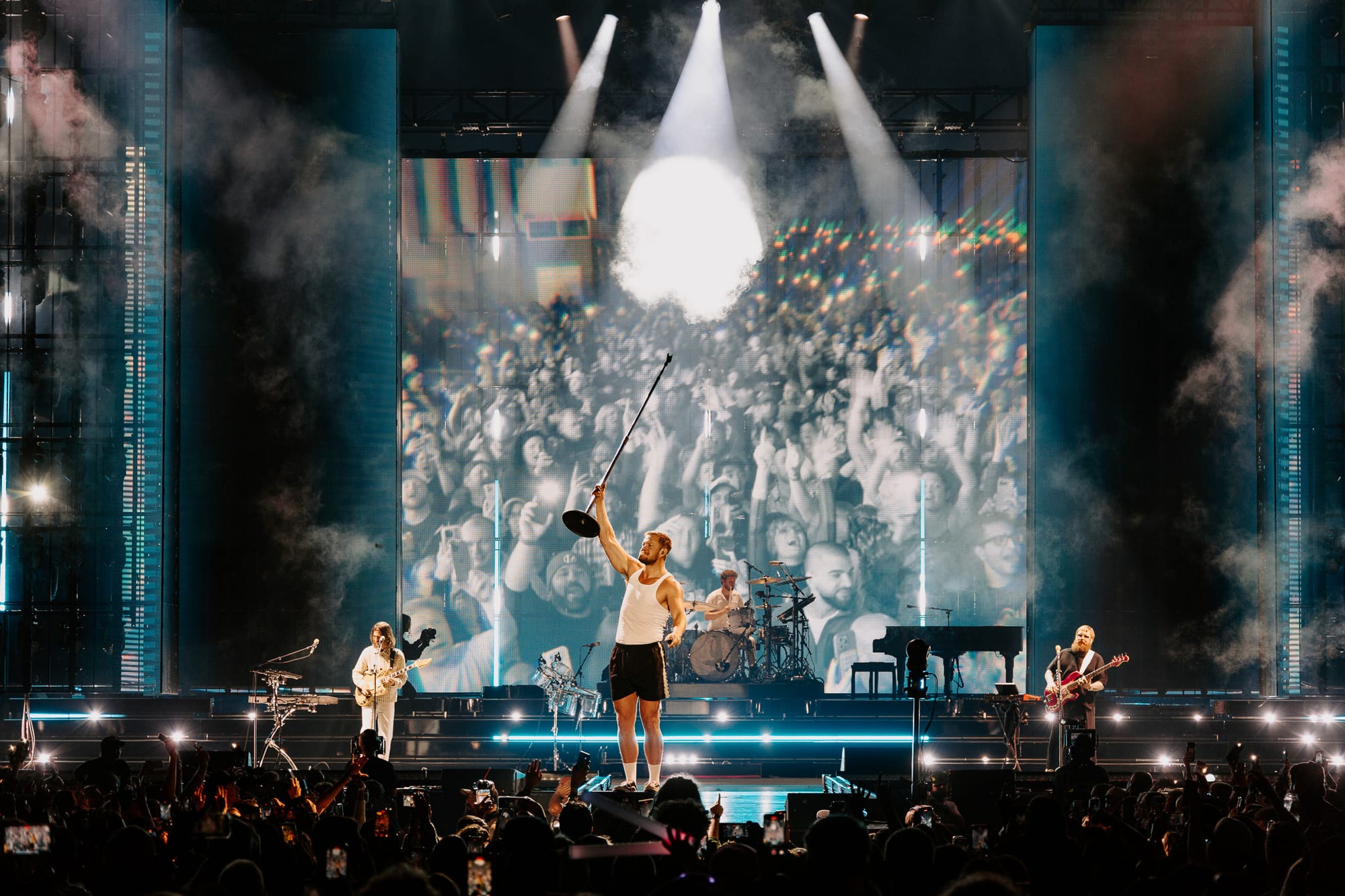 Imagine Dragons performing live, opening frame