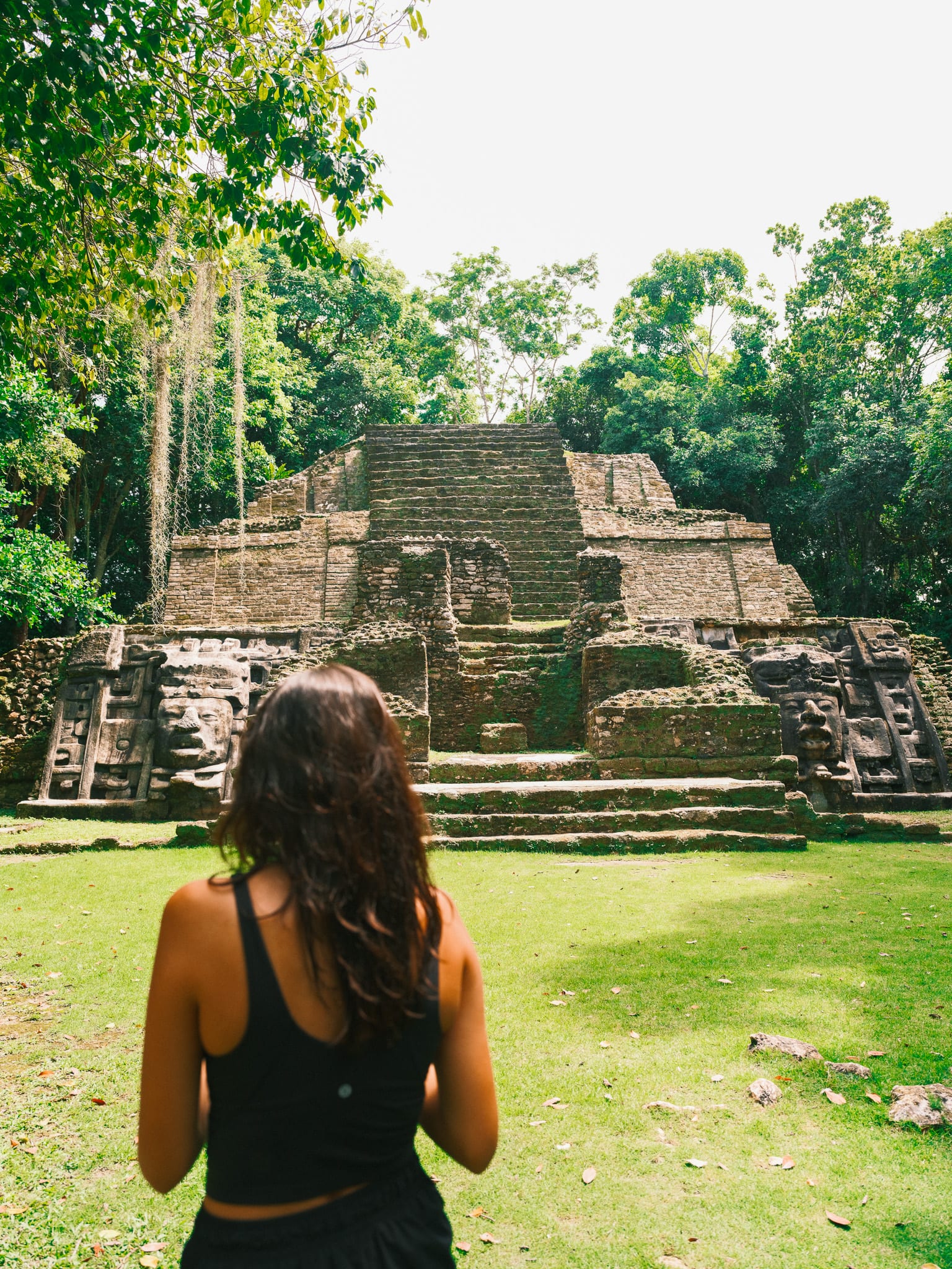 Guest exploring a historic stone site in Belize