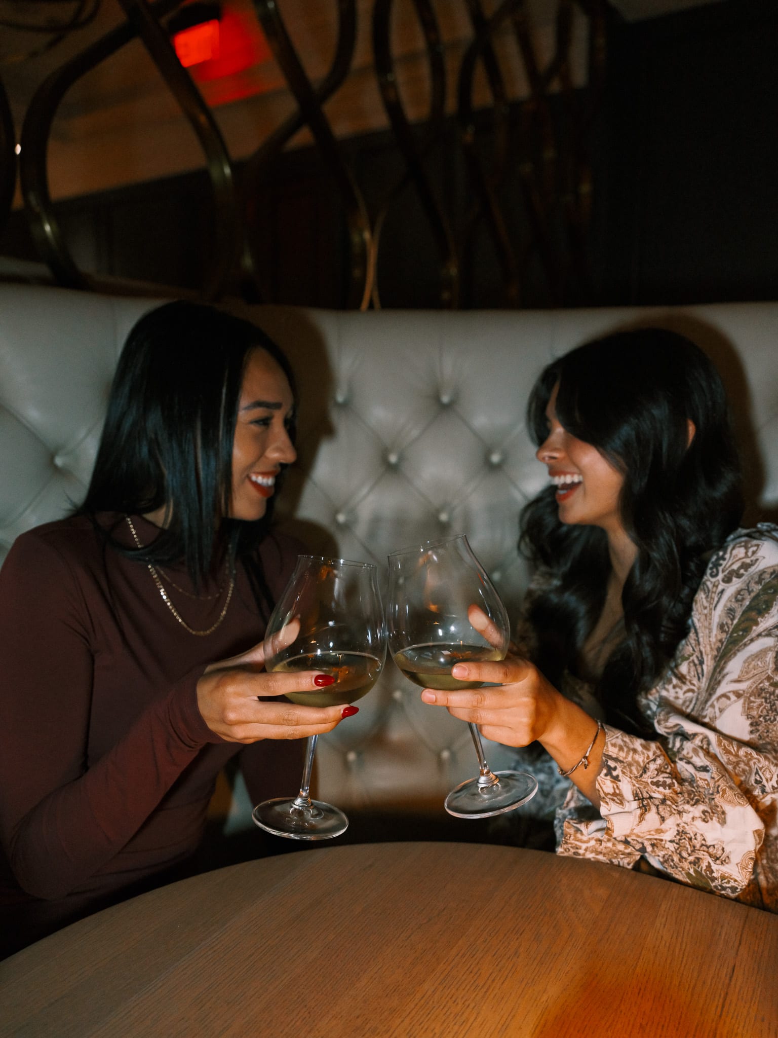 Guests sharing drinks at Boulevard Vancouver