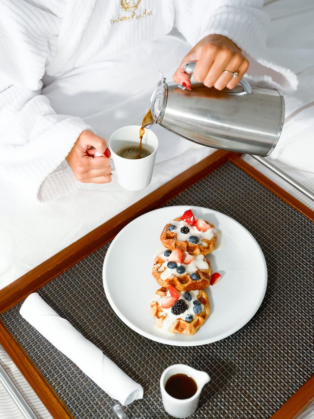Coffee being poured with breakfast in a Sutton Place suite