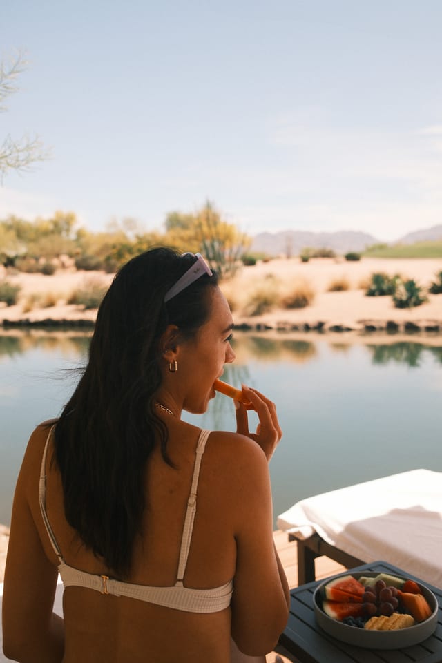 Guest looking across the water at Desert Ridge
