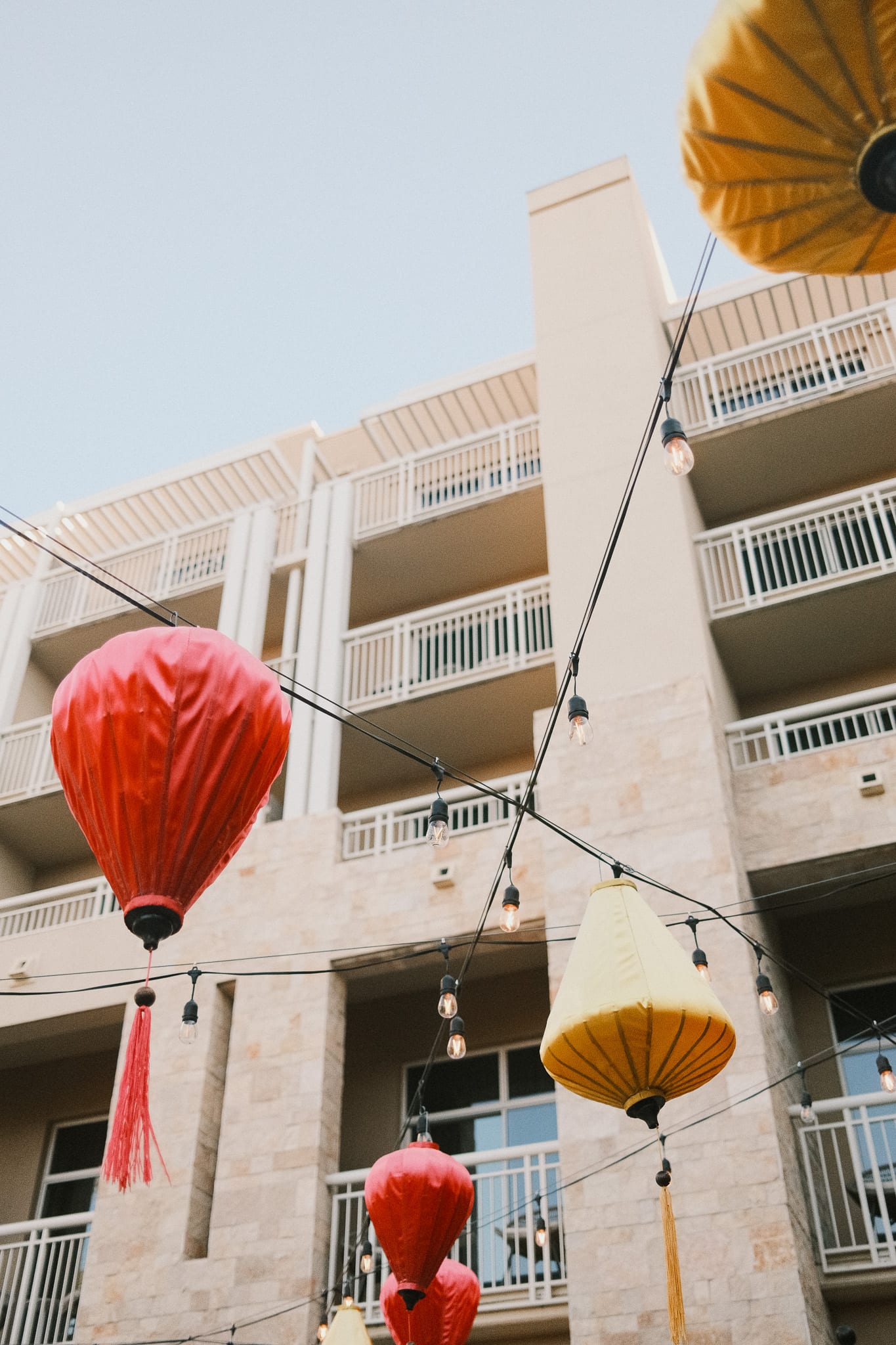 Colorful lanterns suspended against the Desert Ridge architecture