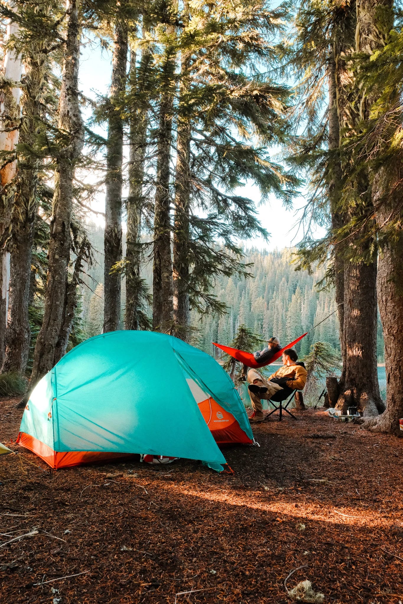 Lakeside campsite with a WindQuester tent, CLIQ chair and Kammok hammock