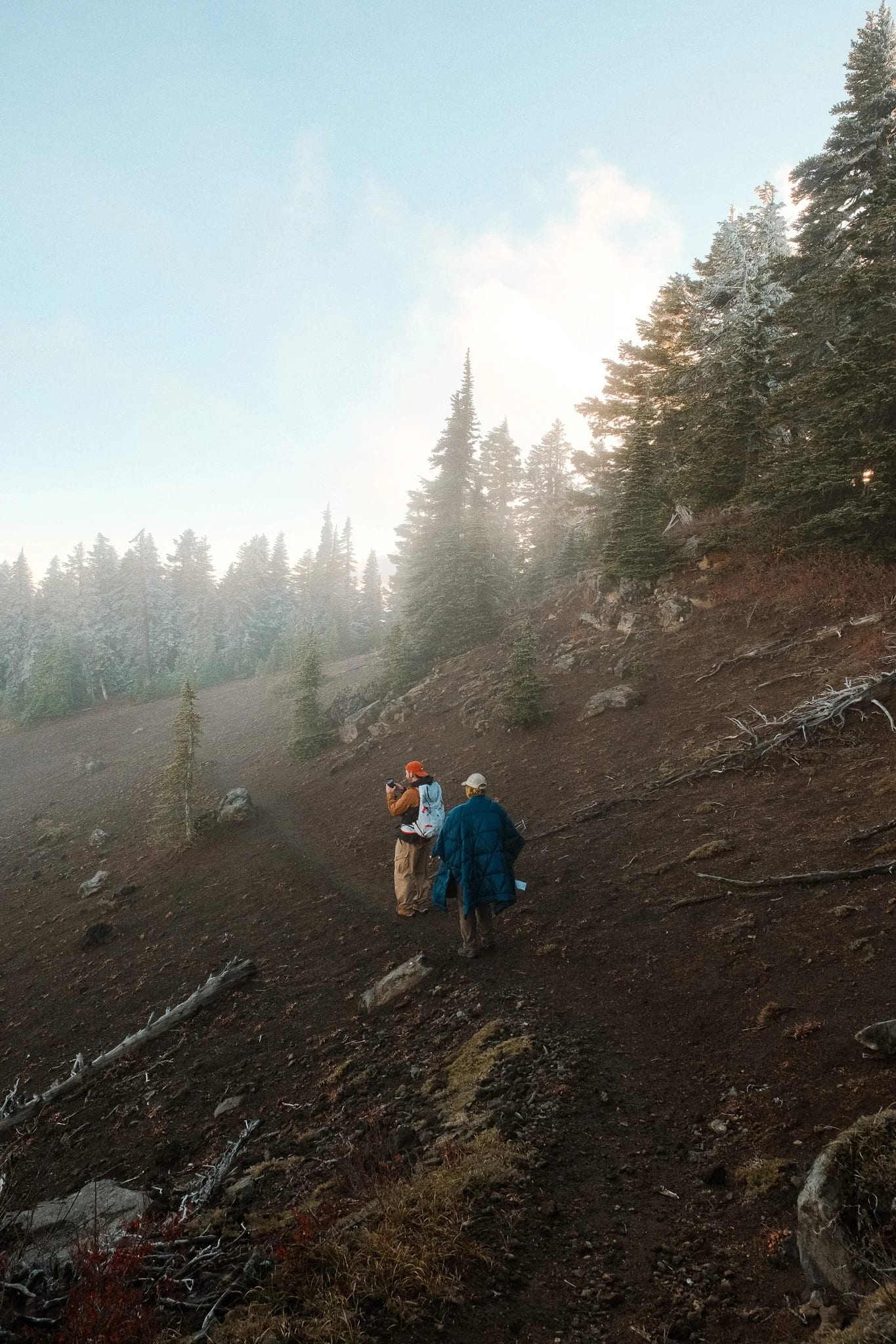 Hikers following a rocky trail through the mountain landscape