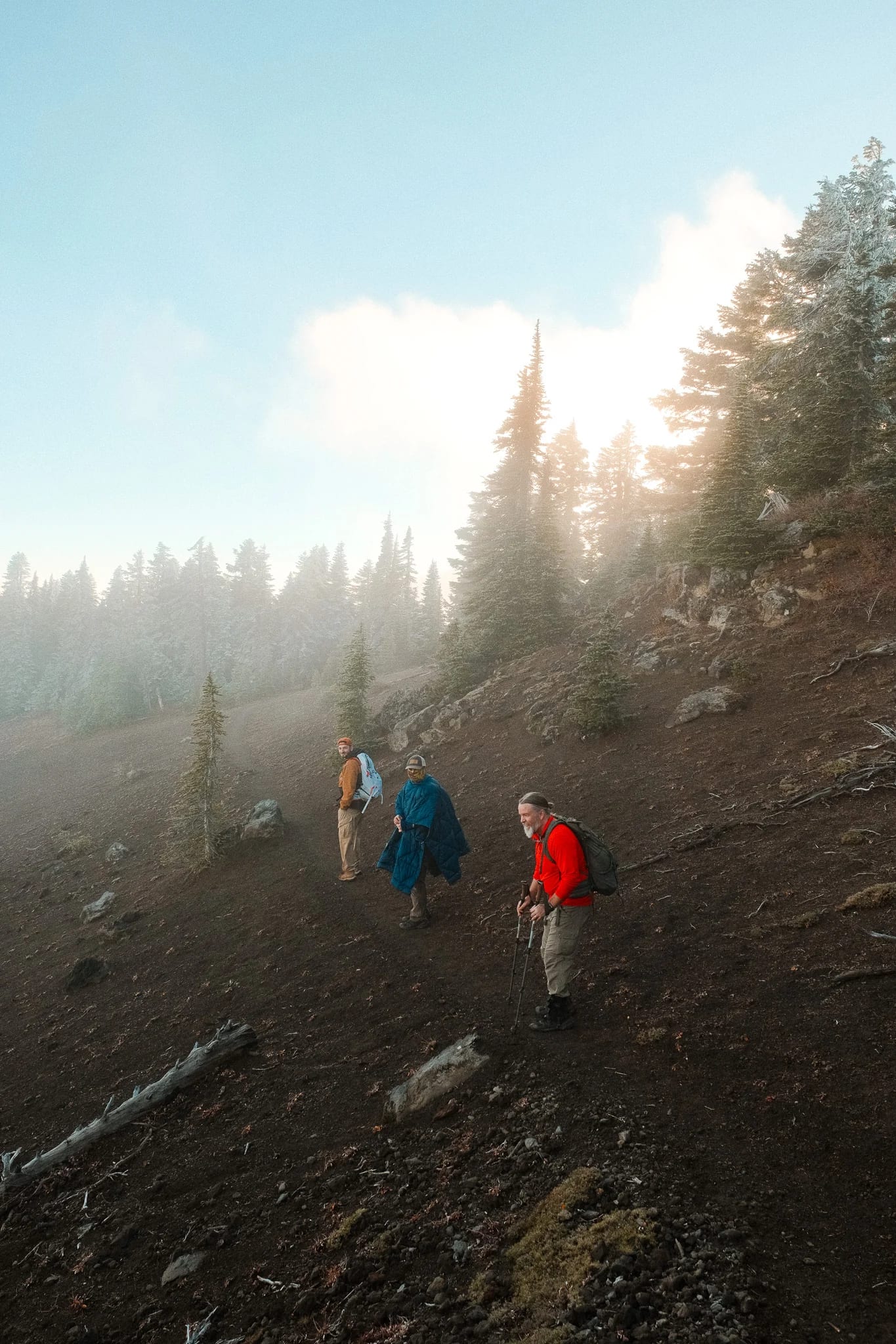 Hikers following a rocky trail through the mountain landscape