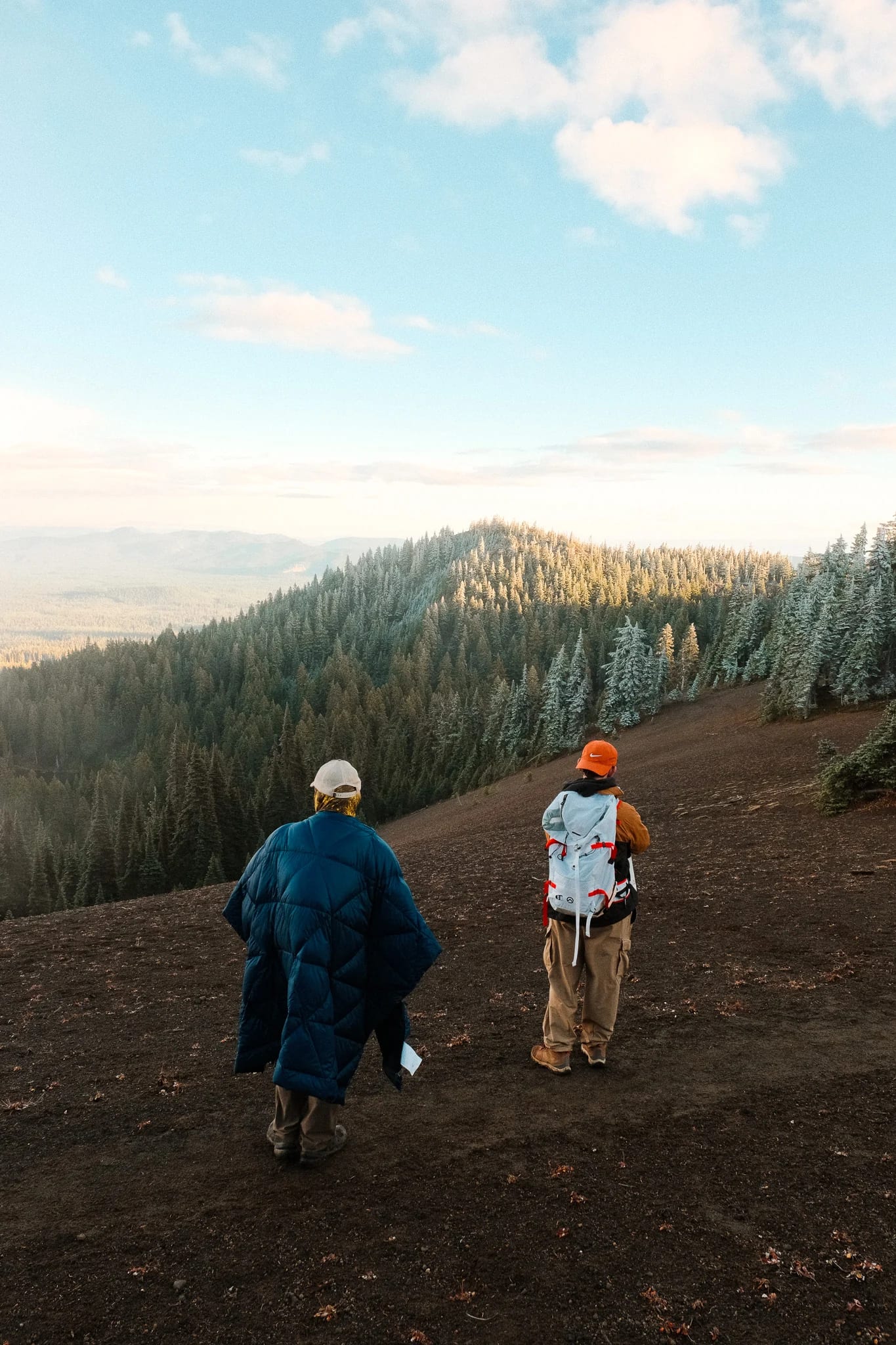 Hikers following a rocky trail through the mountain landscape