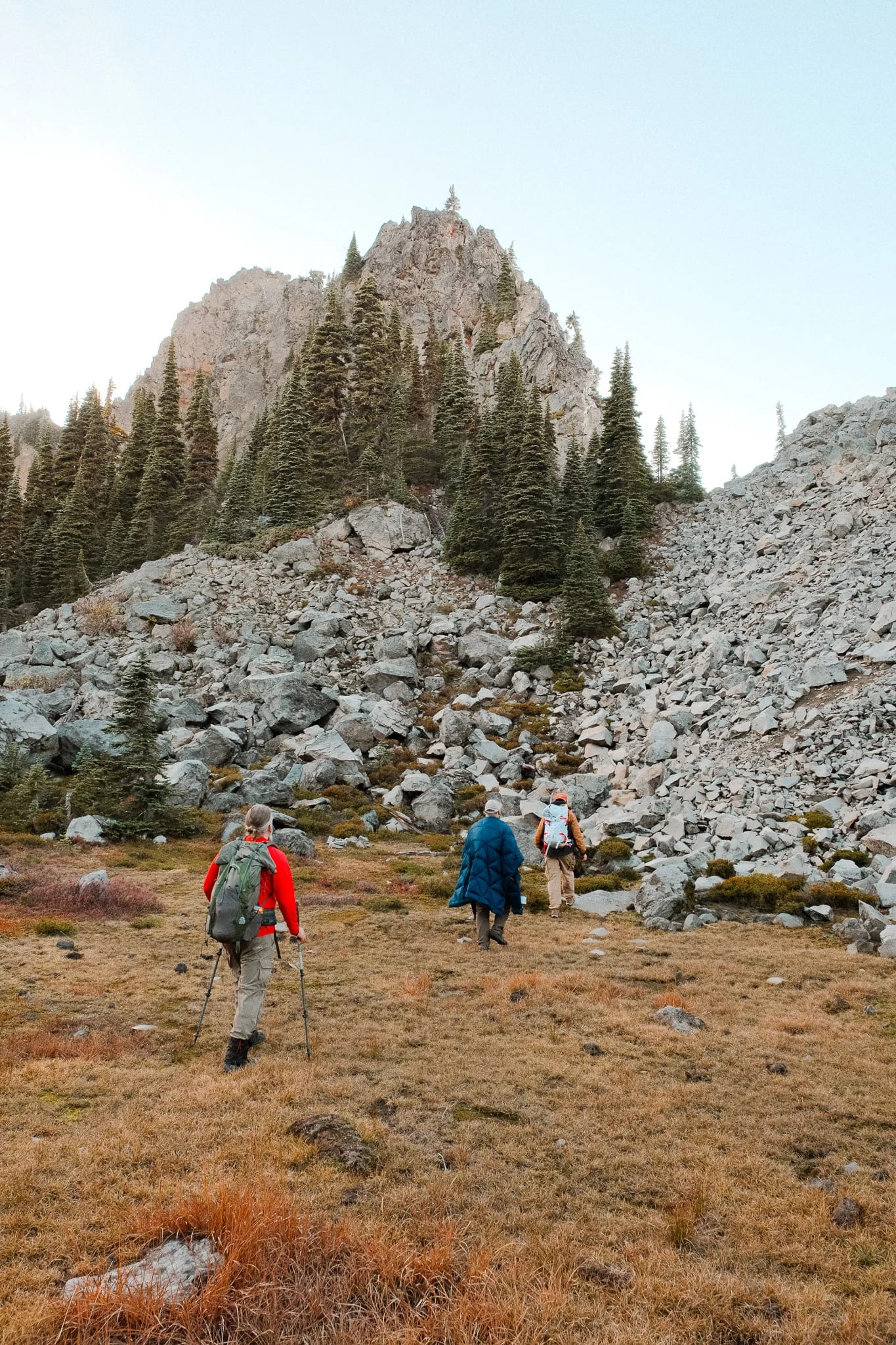 Hikers following a rocky trail through the mountain landscape