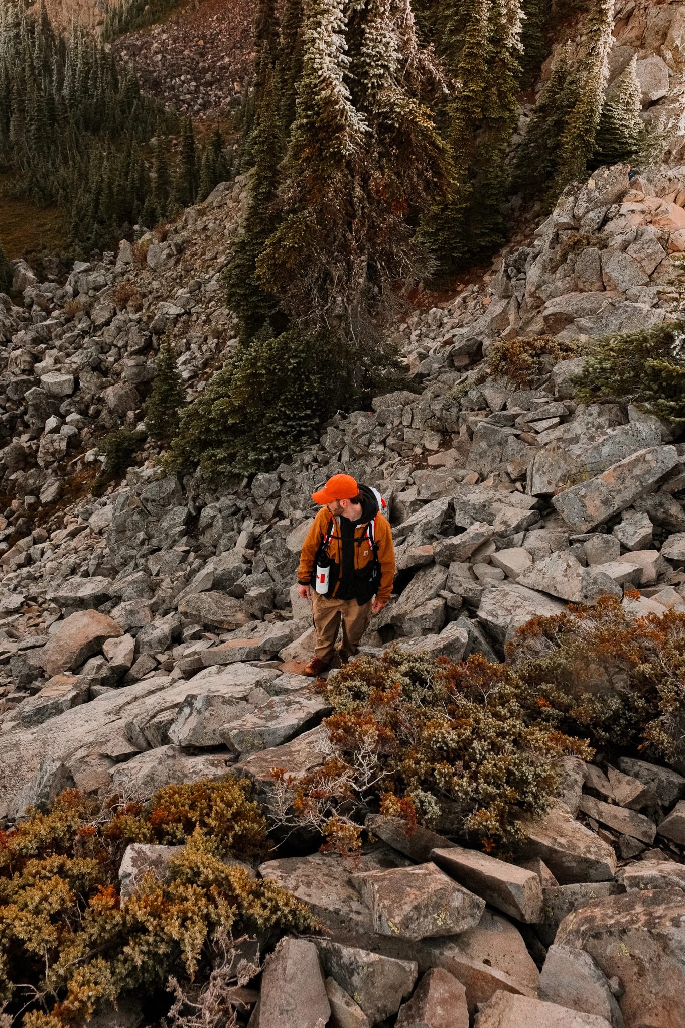 Hikers following a rocky trail through the mountain landscape