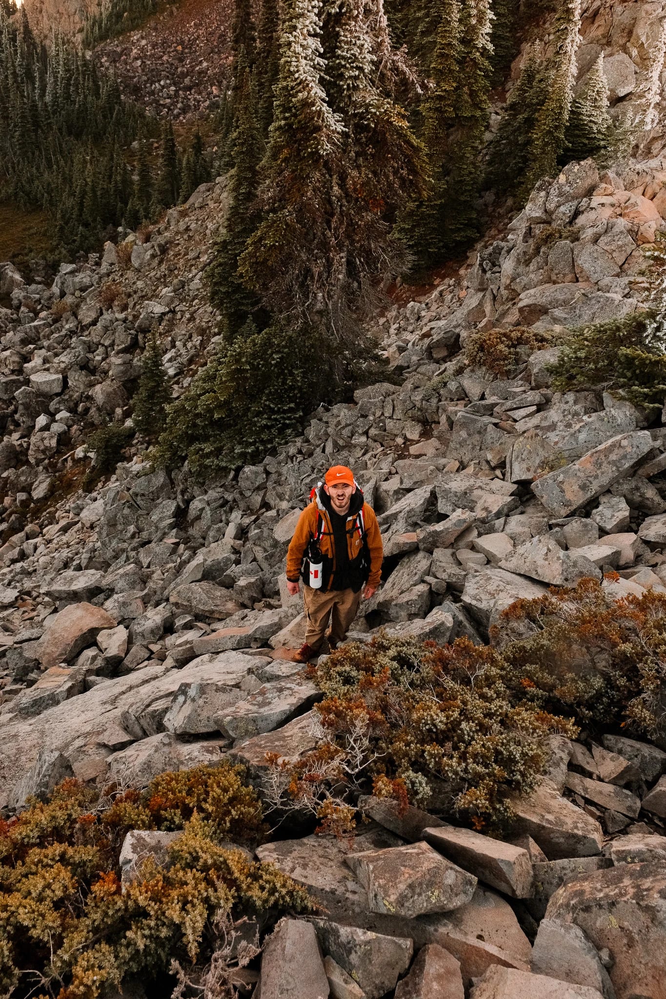 Hikers following a rocky trail through the mountain landscape