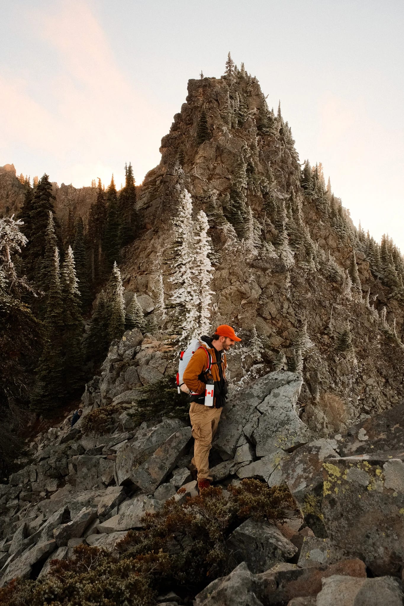 Hikers following a rocky trail through the mountain landscape