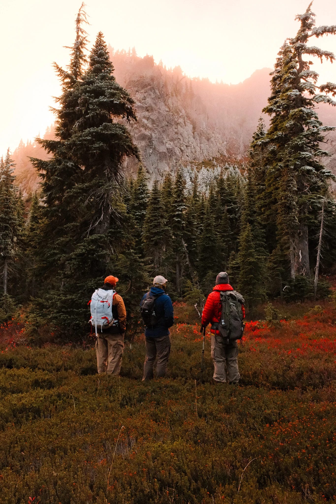 Hikers following a rocky trail through the mountain landscape