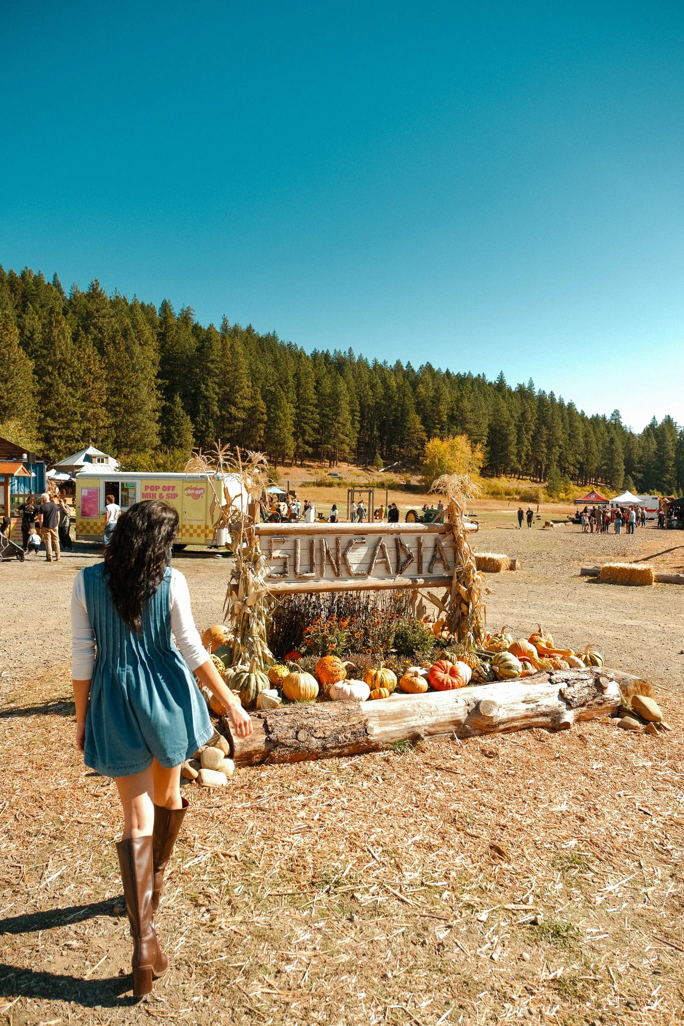 Guest beside a Suncadia autumn display