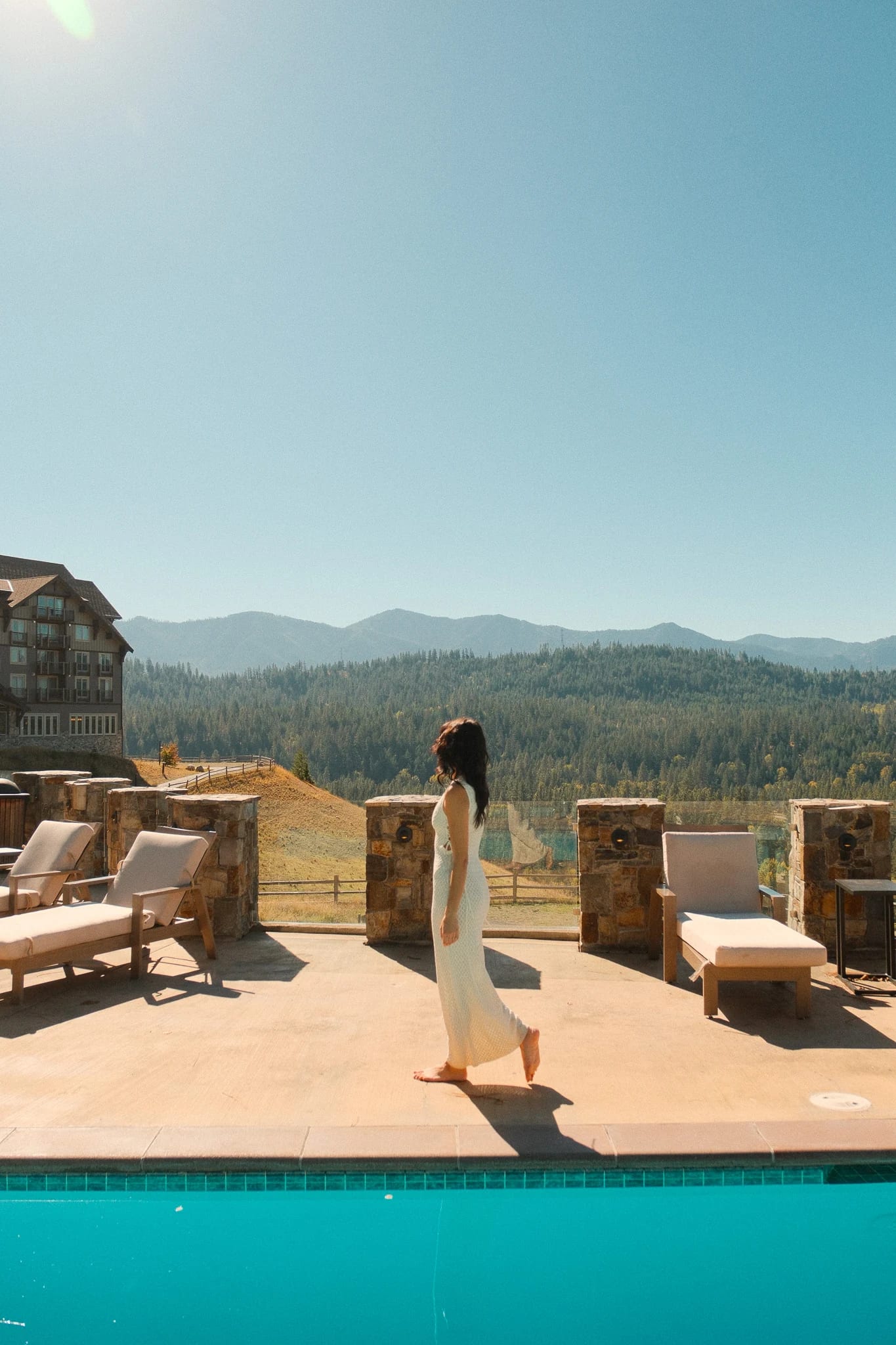 Guest walking beside the Suncadia pool