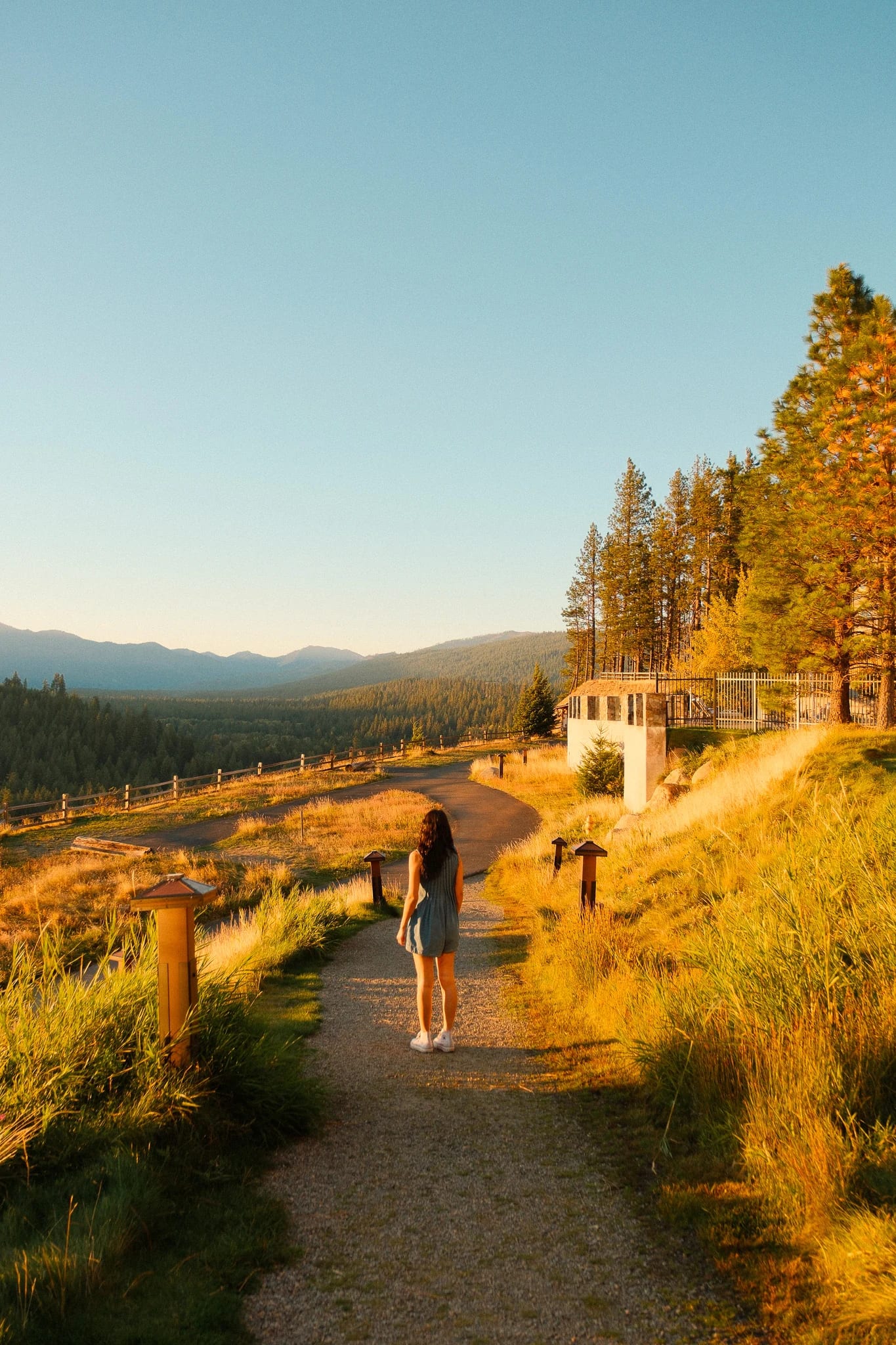 Guests walking a scenic path in golden evening light