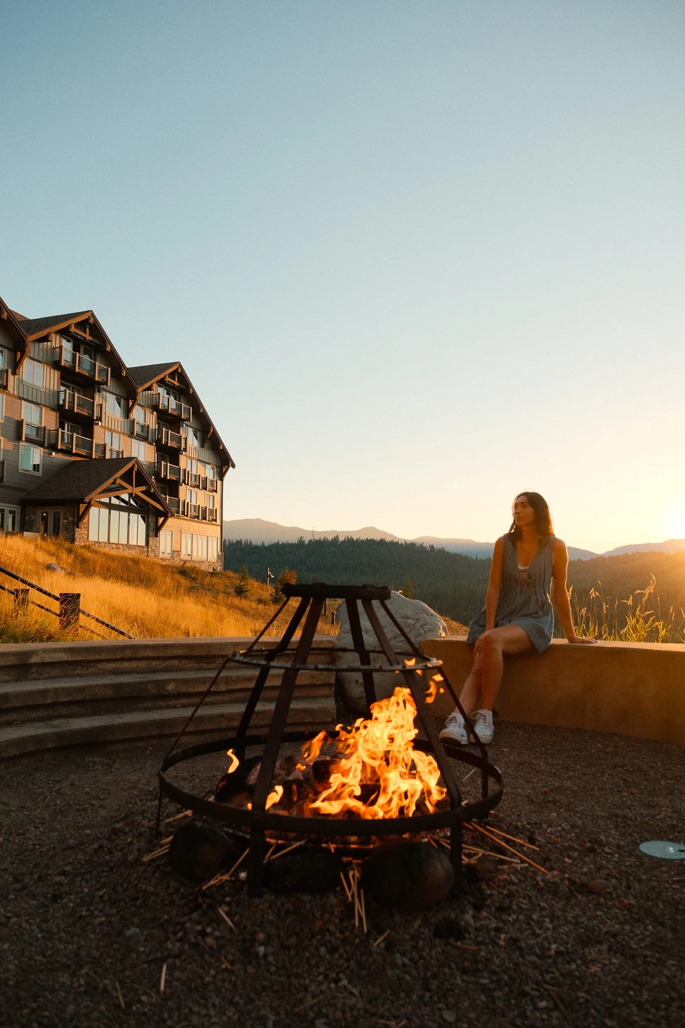 Guest beside an outdoor fire pit at Suncadia