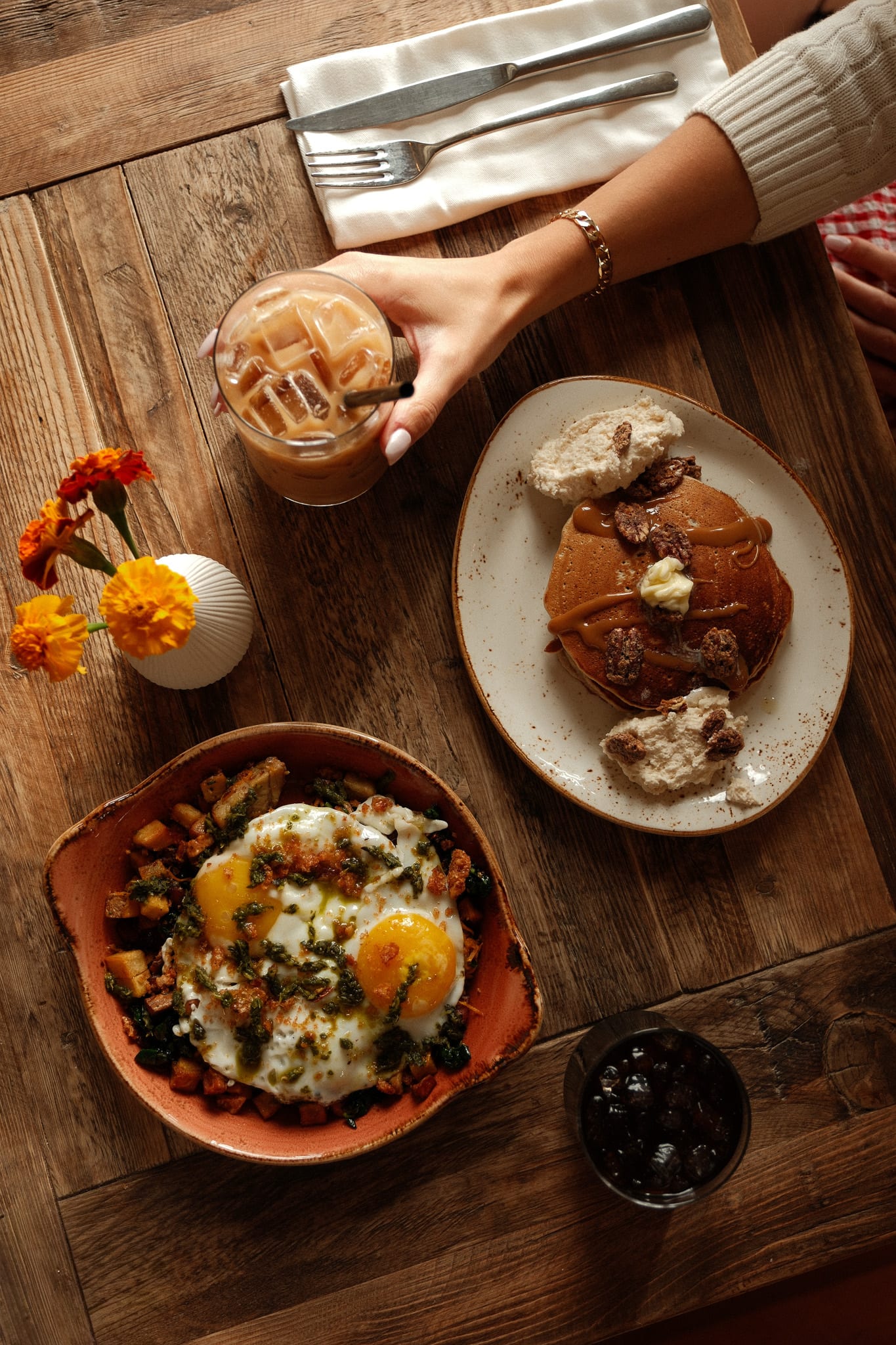 A warmly lit table of brunch dishes and drinks at Black Walnut Inn.