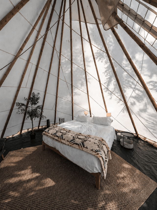 Sunlit teepee bedroom at Sage Cliff Resort
