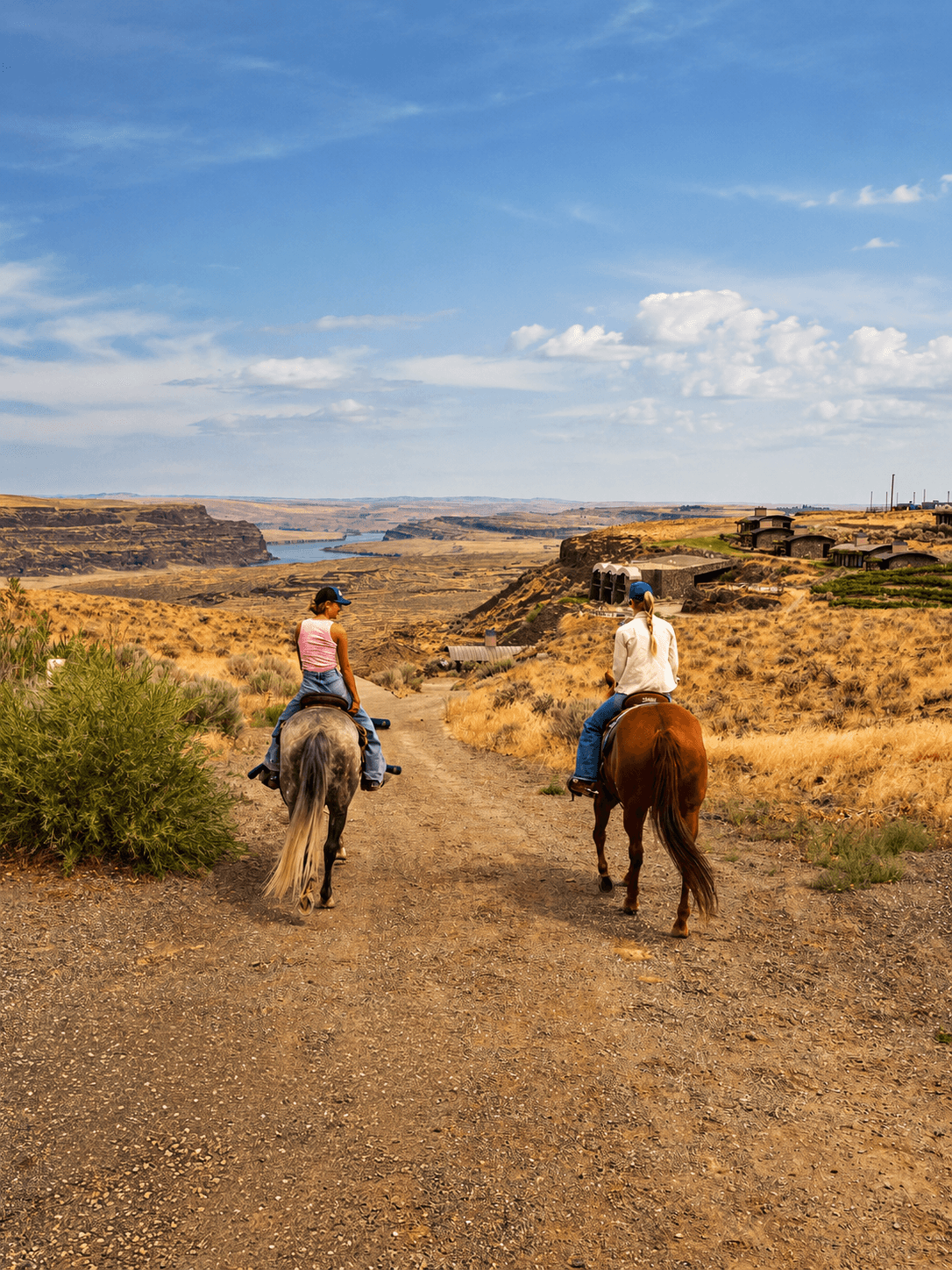 Two riders crossing the high-desert trail near Sage Cliff Resort